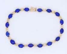 Attractive Yellow Gold Oval Lapis and Greek Key Station Bracelet