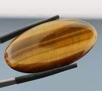 Full body shimmer! 50.03ct Golden Tiger Eye cabochon