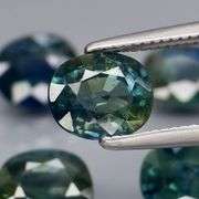 Heated only! 5.03ct blue green Sapphire set
