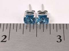 Sparkling Blue Topaz Stud Earrings in White Gold