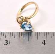 Pretty Blue Topaz And Diamond Ring In 14K Yellow Gold