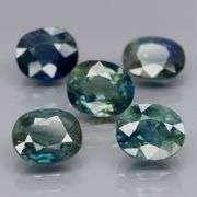 Heated only! 5.03ct blue green Sapphire set