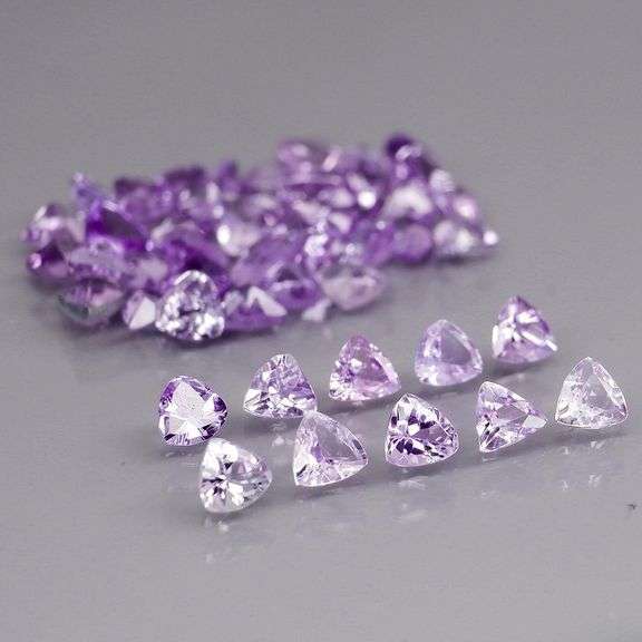 Heavy flashing 4.88ct trillion cut Tanzanite set