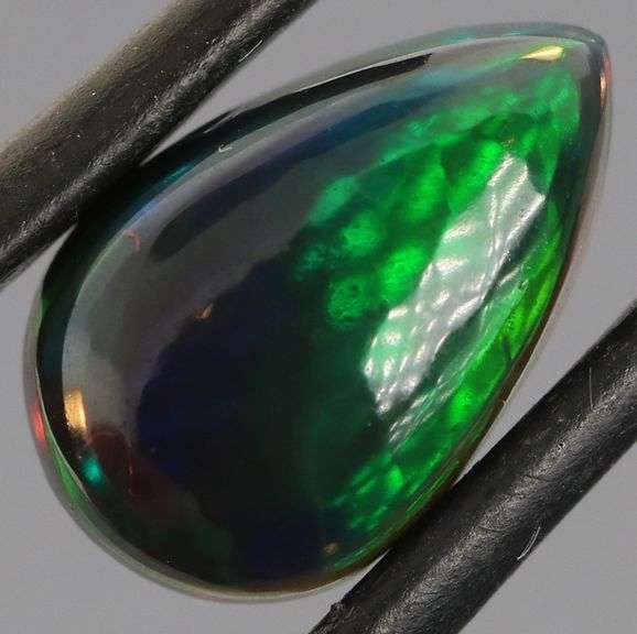 Magnificent 2.40ct teal and green flashing Black Opal