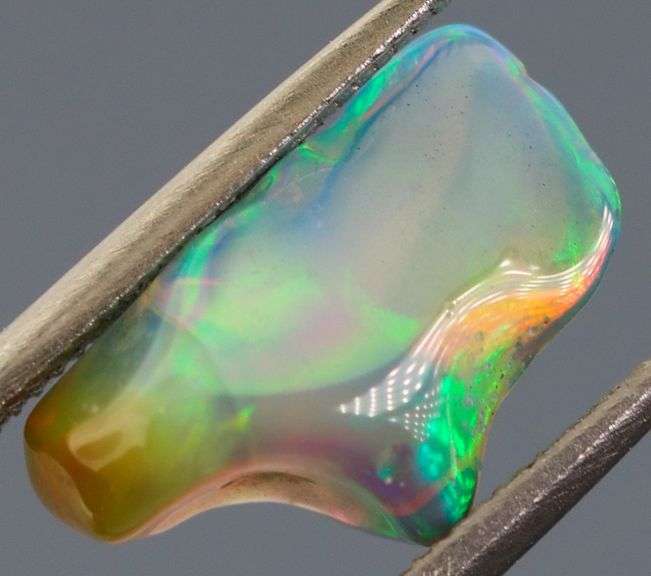 High fire collectors 2ct free form black Opal vein