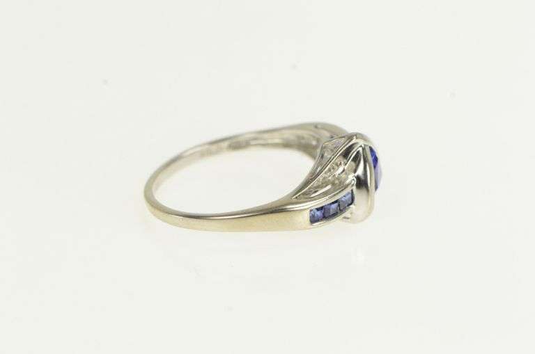10K White Gold Trillion Syn. Sapphire Diamond Wavy Bypass Ring