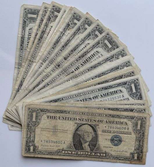 23 $1 1957 A Silver Certificates Including 3 Stars.
