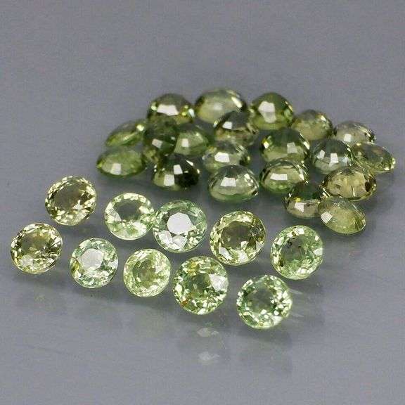 Fantastic 6.23ct diamond cut GREEN Sapphire set