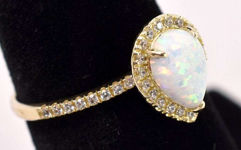Gleaming Opal And Diamond Ring In Yellow Gold