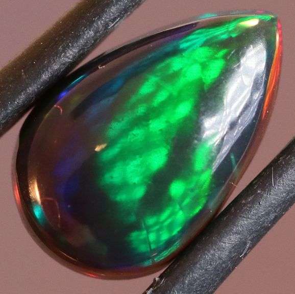 Magnificent 2.40ct teal and green flashing Black Opal
