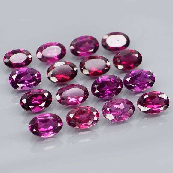 Amazing 8.92ct oval cut violet pink Garnet set