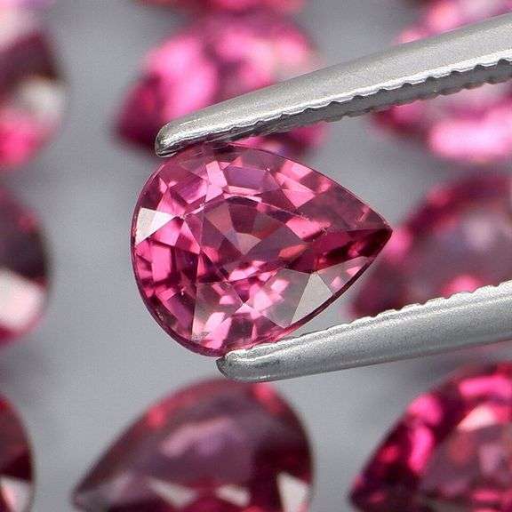 Premium pear cut 7.52ct VS Rhodolite Garnet set