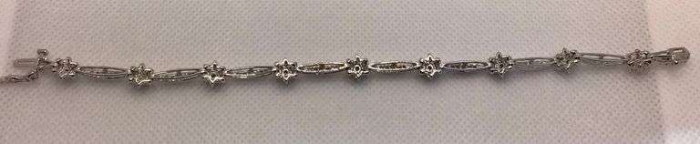 FLAWLESS AND STYLISH 14K WHITE GOLD FLORAL DIAMOND BRACELET