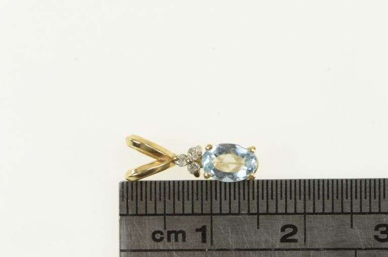 14K Yellow Gold Oval Blue Topaz Diamond Cluster Accent Pendant