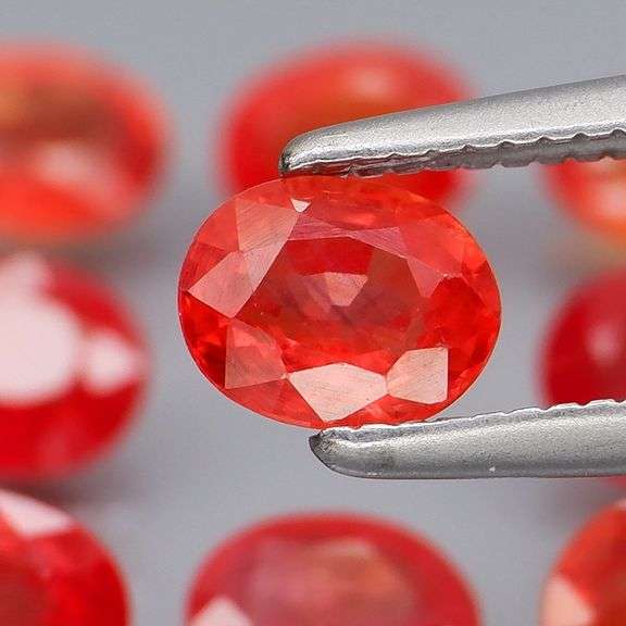 Uniquely colored 4.74ct Imperial red Sapphire set