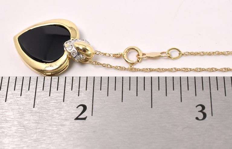 Endearing Black Onyx And Diamond Heart Pendant Necklace In 14K Yellow Gold