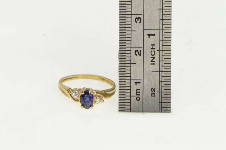 10K Yellow Gold Oval Syn. Sapphire Cubic Zirconia Accent Ring