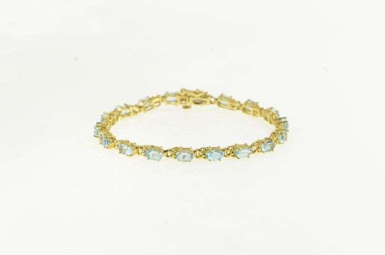 14K Yellow Gold Oval Blue Topaz Flower Blossom Tennis Bracelet
