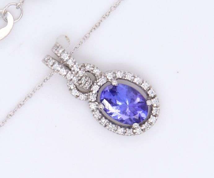 Attractive White Gold Tanzanite and Diamond Halo Pendant on Chain