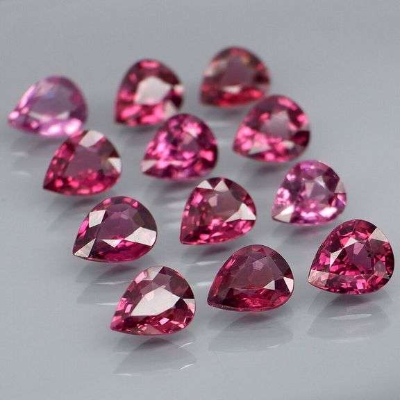 Premium pear cut 7.52ct VS Rhodolite Garnet set