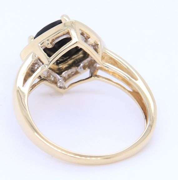 Charming Yellow Gold Black Onyx and Diamond Halo Cocktail Ring