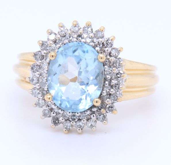 Gorgeous Yellow Gold Oval Aqumarine and Diamond Ring