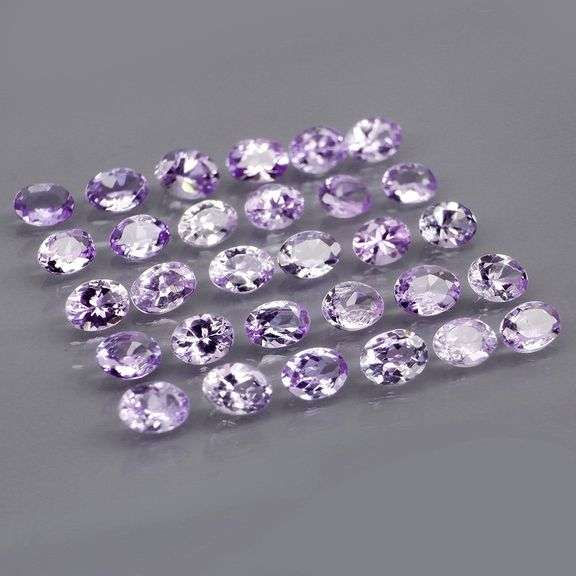 Heavy flashing 4.78ct oval cut Tanzanite set