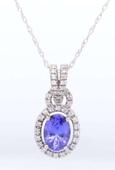 Attractive White Gold Tanzanite and Diamond Halo Pendant on Chain