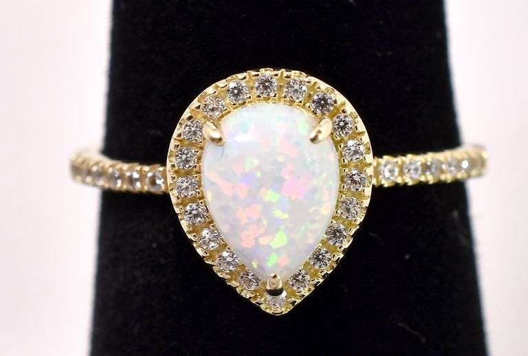 Gleaming Opal And Diamond Ring In Yellow Gold