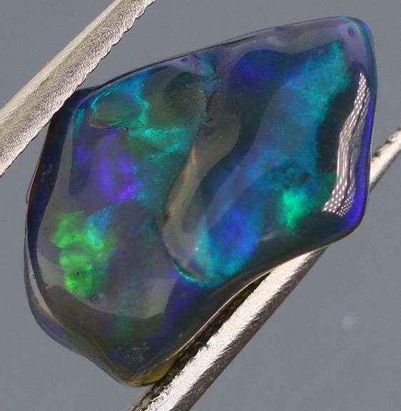 High fire collectors 2.25ct free form black Opal vein