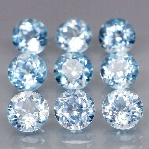 Superb quality 9.56ct 9 pc sky blue Topaz solitaire set