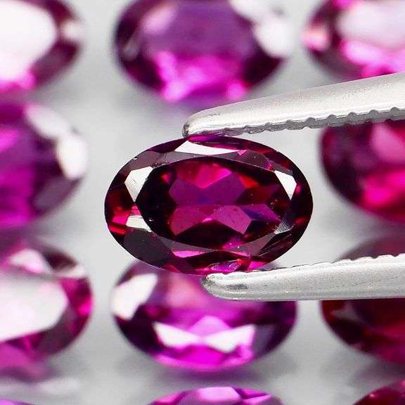 Rich 6.80ct oval cut violet pink Rodolite Garnet set