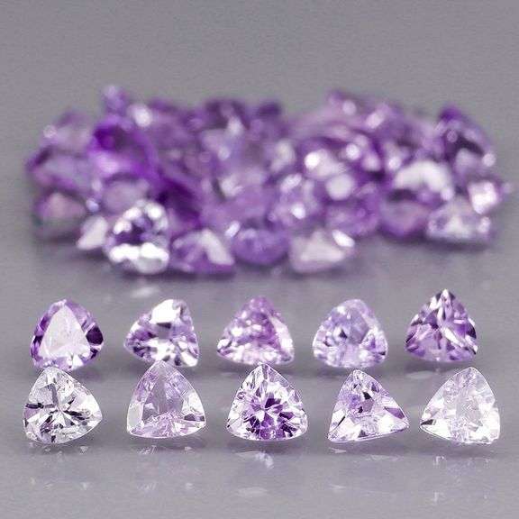 Heavy flashing 4.88ct trillion cut Tanzanite set