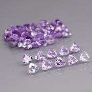 Heavy flashing 4.88ct trillion cut Tanzanite set