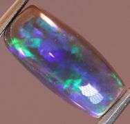 Outstanding 1.79ct full body flashing Black Opal
