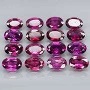 Amazing 8.92ct oval cut violet pink Garnet set