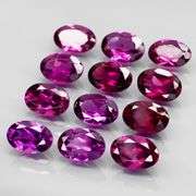 Rich 6.80ct oval cut violet pink Rodolite Garnet set