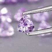 Heavy flashing 4.88ct trillion cut Tanzanite set