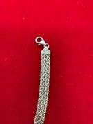 ITALIAN 18K YELLOW GOLD THREE ROW FLAT WHEAT LINK BRACELET.