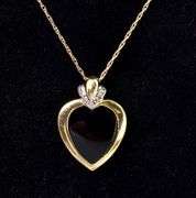 Endearing Black Onyx And Diamond Heart Pendant Necklace In 14K Yellow Gold