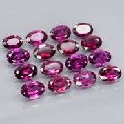 Amazing 8.92ct oval cut violet pink Garnet set