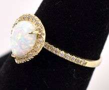 Gleaming Opal And Diamond Ring In Yellow Gold