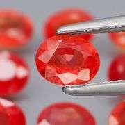 Uniquely colored 4.74ct Imperial red Sapphire set