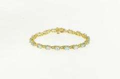 14K Yellow Gold Oval Blue Topaz Flower Blossom Tennis Bracelet