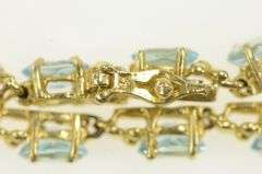 14K Yellow Gold Oval Blue Topaz Flower Blossom Tennis Bracelet