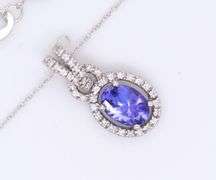 Attractive White Gold Tanzanite and Diamond Halo Pendant on Chain