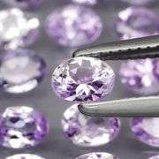 Heavy flashing 4.78ct oval cut Tanzanite set