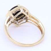 Charming Yellow Gold Black Onyx and Diamond Halo Cocktail Ring