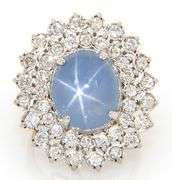 6.00ct Oval Star Sapphire Cabochon and 2.00ctw Diamond Starburst Frame Ring in 14K