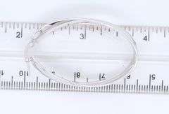 Handsome White Gold Twisted Oval Hoop Earrings